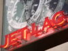 Neon sign that reads 'jet lag'